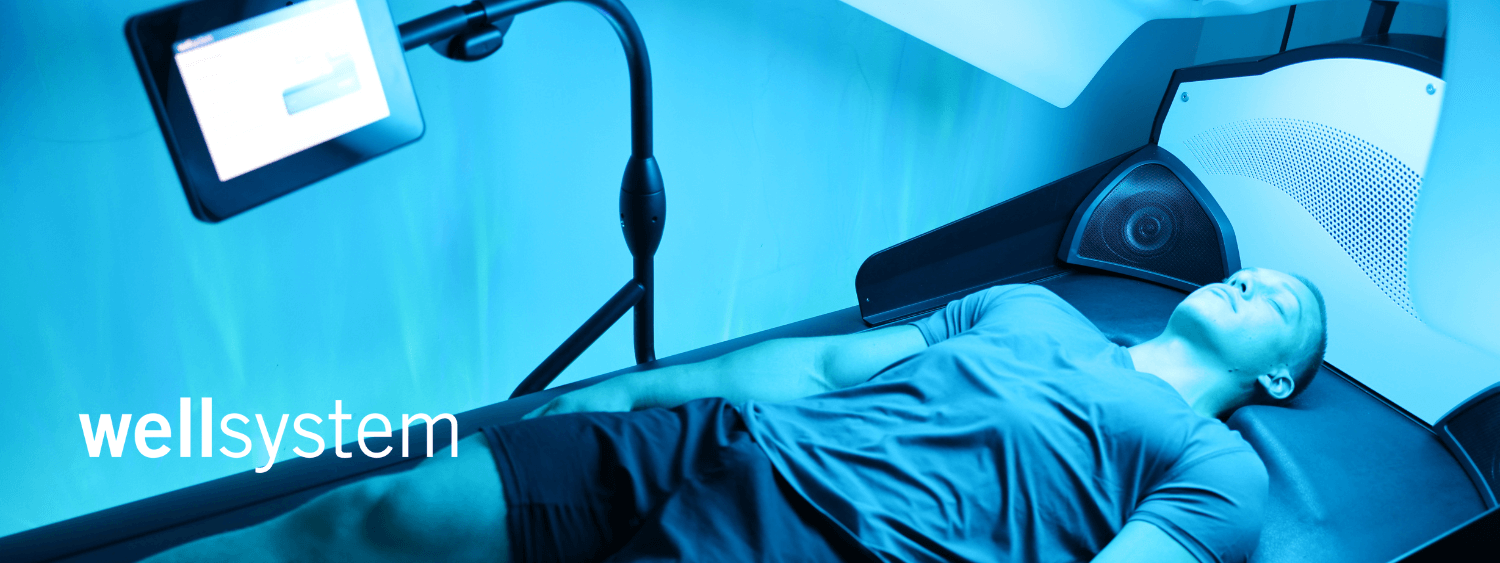 client relaxing on hydro massage bed in wellness spa treatment room