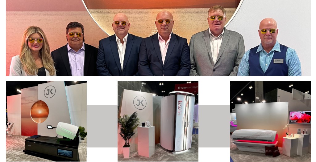 JK America leadership team with tanning equipment display at industry event
